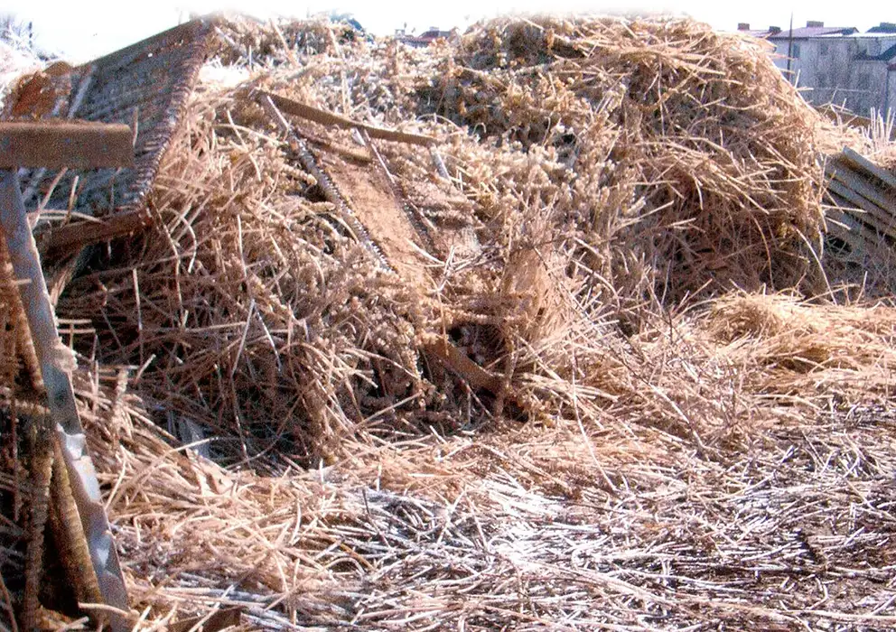 large-piles-of-scrap-and-weathered-materials-outside.webp