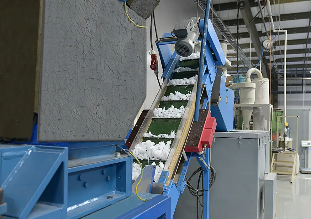 wide-shot-of-machine-processing-scrap-materials.webp