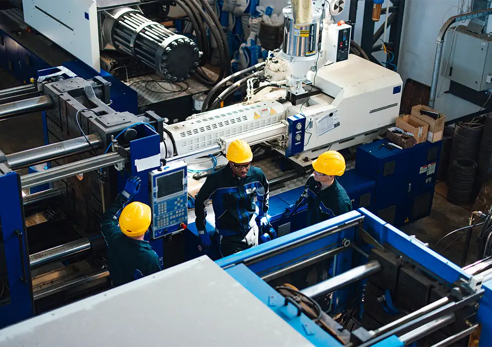 group-of-industrial-workers-operating-machinery-in-factory.webp
