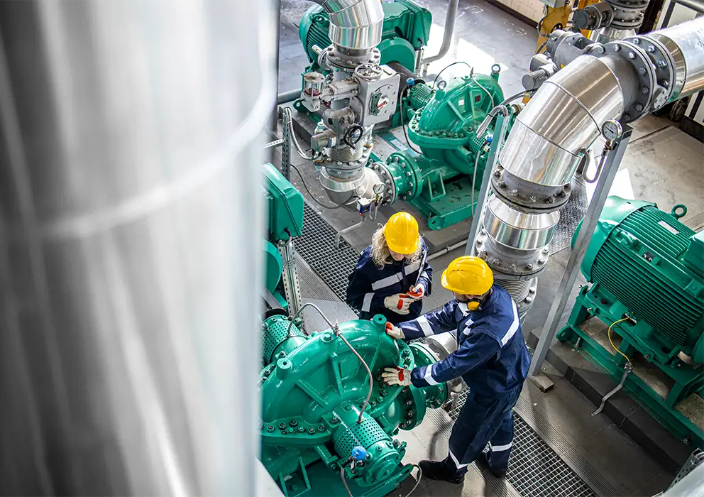 aerial-view-of-industrial-workers-in-oil-gas-factory.webp